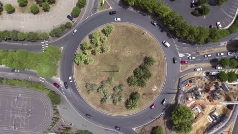 Flying-over-a-roundabout-in-south-of-France,-aerial-vertical-drone-shot.